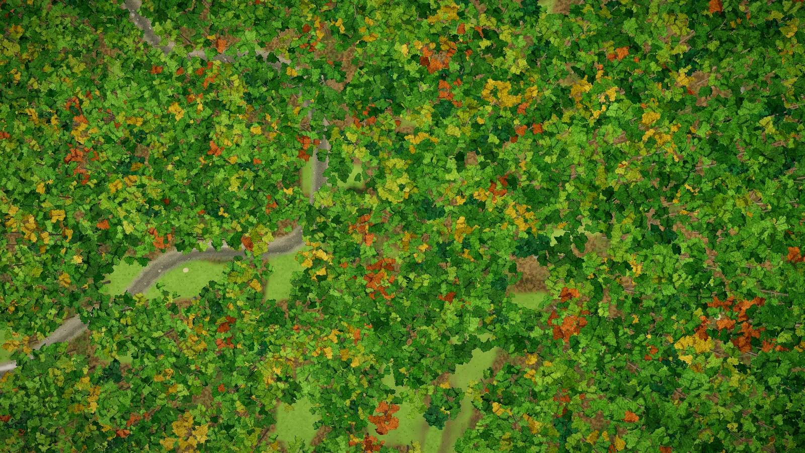 The paintball field in the game from straight above: woods in autumn colour, the creek showing through